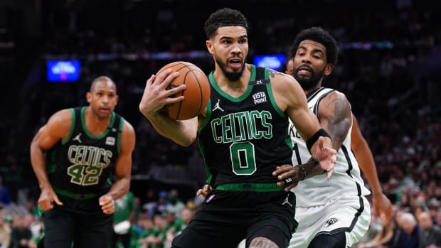 Boston Celtics forward Jayson Tatum, Al Horford; Brooklyn Nets guard Kyrie Irving